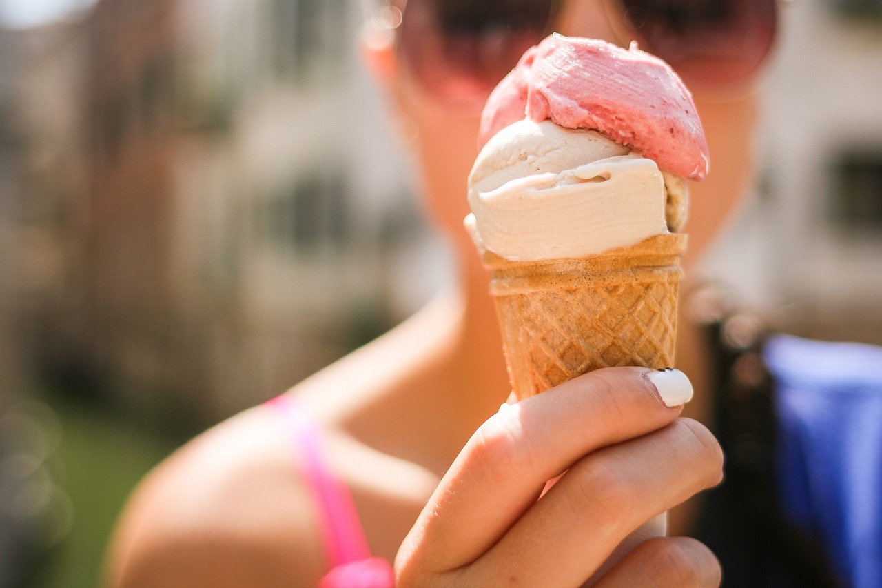 A woman holding an ice cream cone