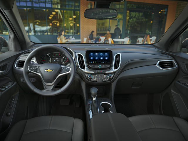 The front driver and passenger seat of a Chevrolet vehicle